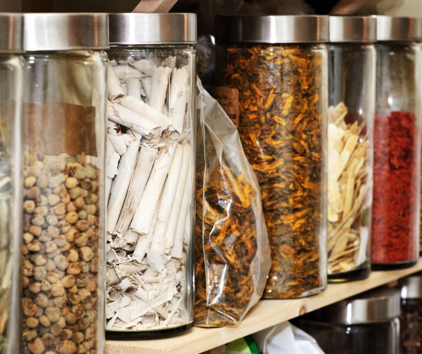 Canisters of different types of herbs