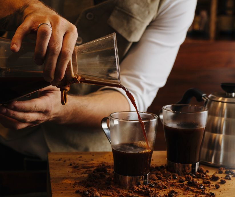 Barista pouring coffee