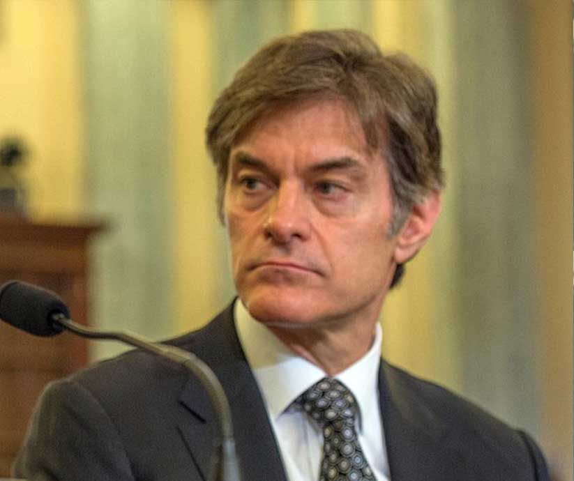 Dr Oz sits in front of microphone in 2014