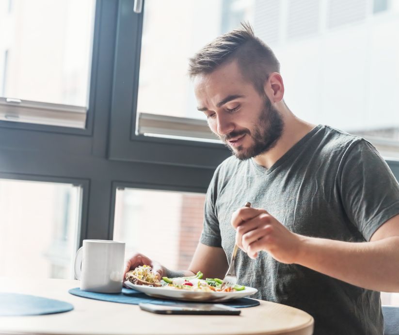 man eating at table