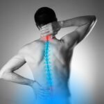 man's back with a graphic of his spine highlighted