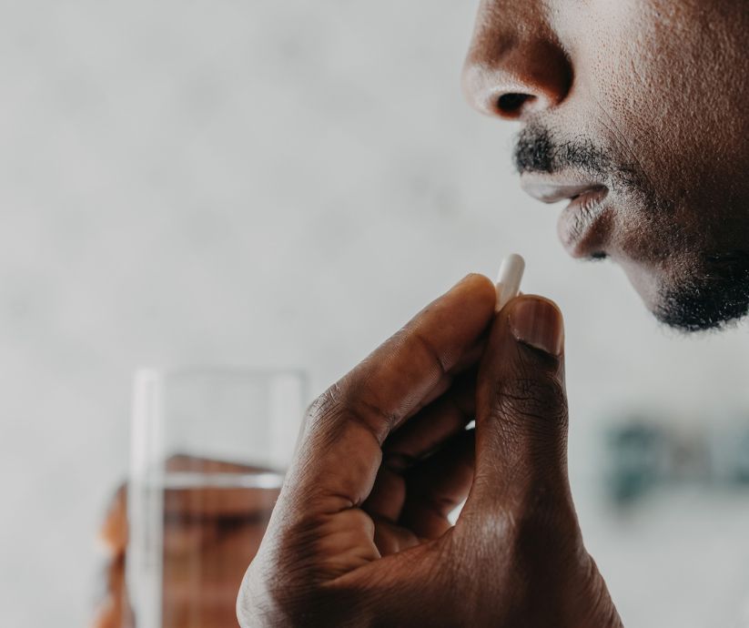 man taking medicine